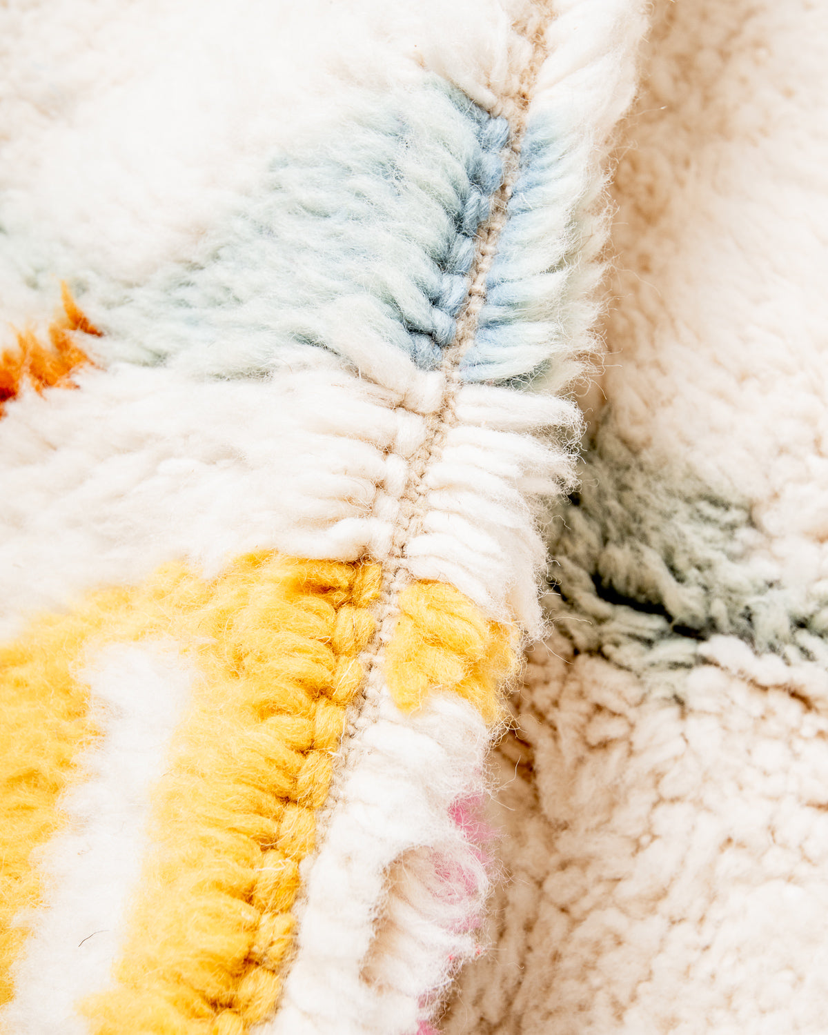 Modern, designer, handcrafted Berber rug from Morocco. Beniourain carpet with beautiful colours and patterns and fluffy wool texture.
